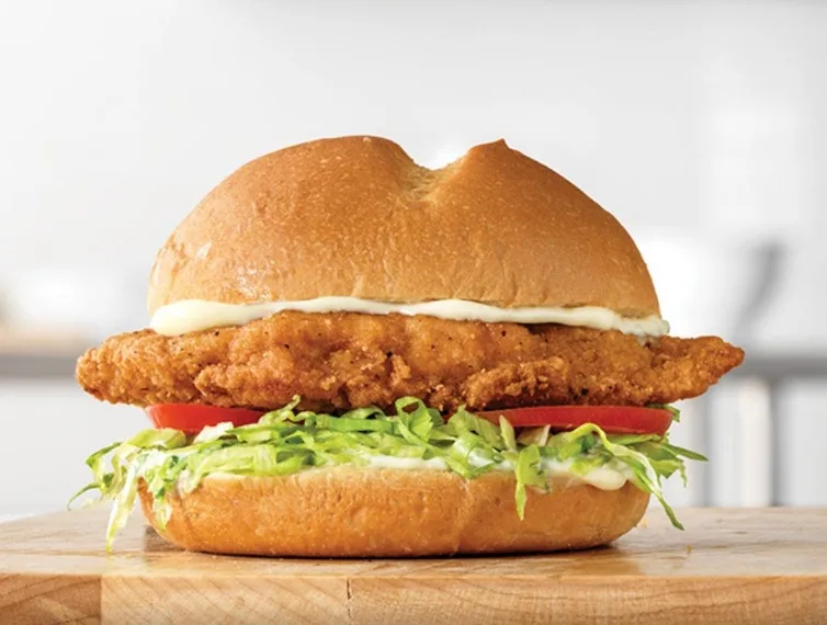 Crispy chicken sandwich with lettuce and tomato (illustrative image)