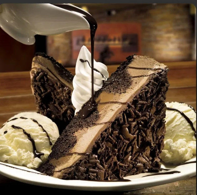 Chocolate Stampede: layered chocolate cake with ice cream and chocolate sauce (illustrative image)