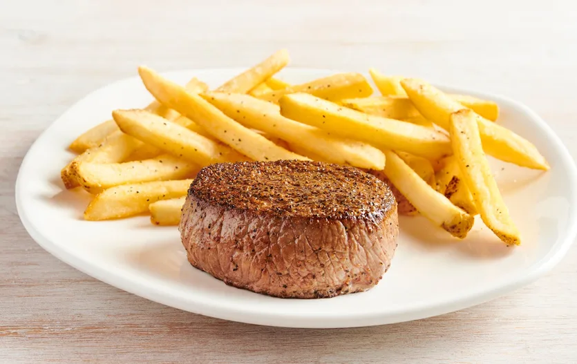 Kid's sirloin steak served with french fries (illustrative image)