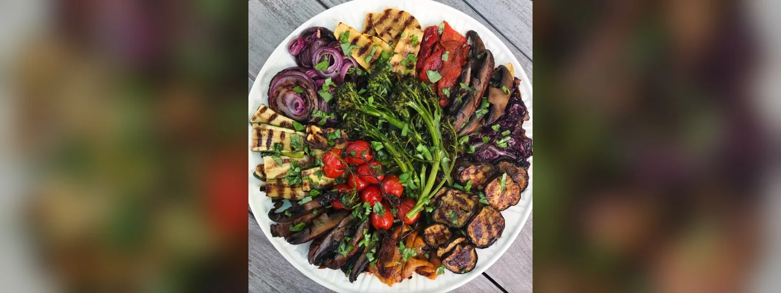 Platter of grilled vegetables including zucchini, mushrooms, eggplant, onions and broccolini (illustrative image)